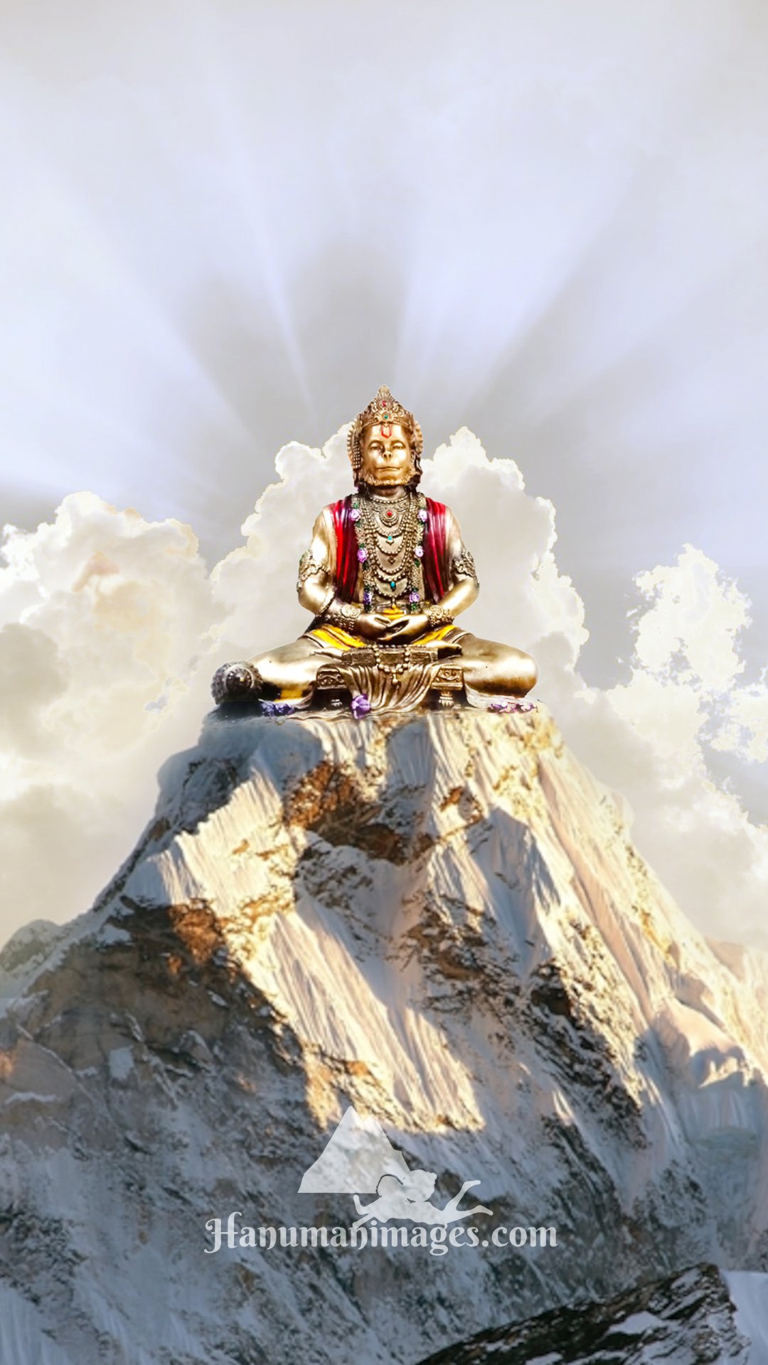 lord hanuman statue on top of mountain